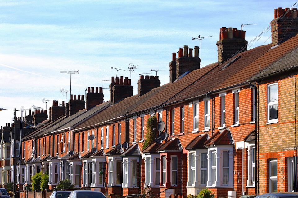 English row terraced house in spring season, England UK. Brick building and environment.